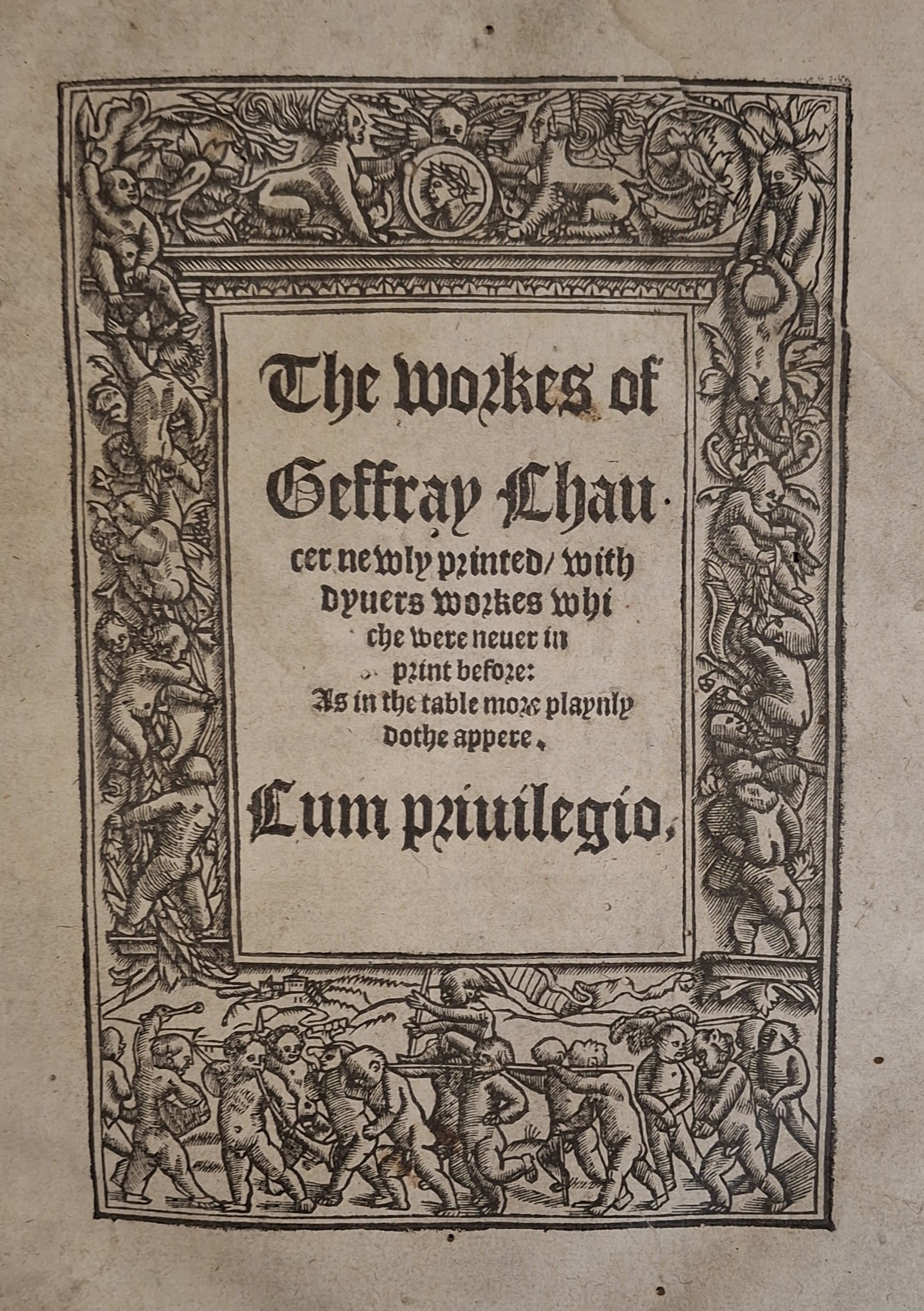 Image of a title page with a woodcut boarder featuring putti.